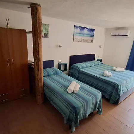 Portopollo Surfhouse C Affittacamere Barrabisa